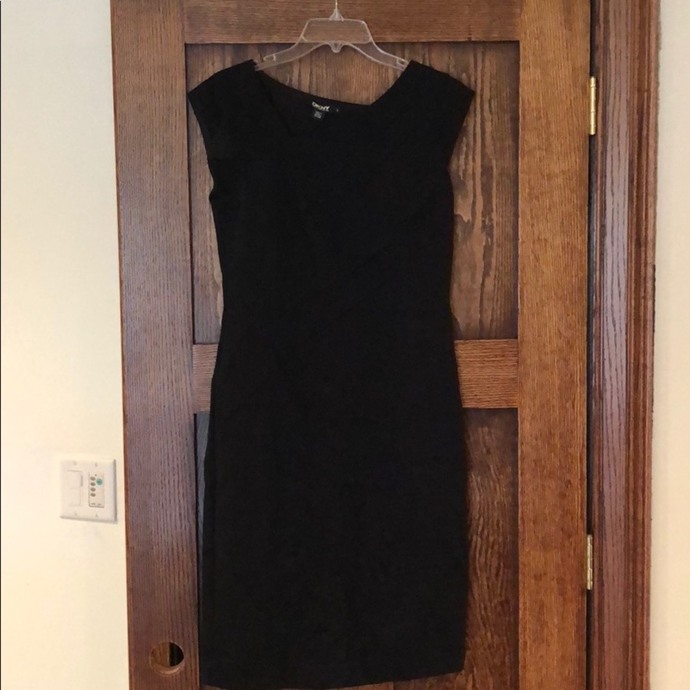 Black dress with asymmetrical neckline